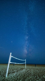 Scenic view of sea against star field at night