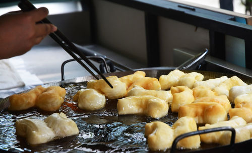 Close-up of person preparing food in kitchen