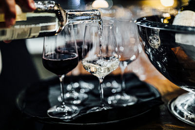 Close-up of wine glasses on table