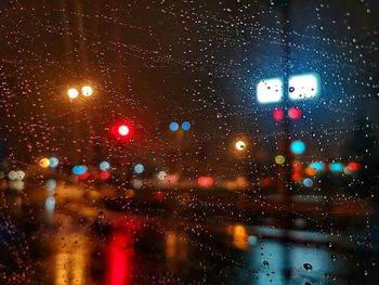 City seen through wet glass window