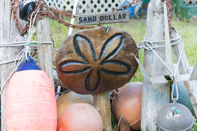 Wood with floral pattern amidst fishing bobbers in yard