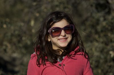 Smiling girl wearing sunglasses