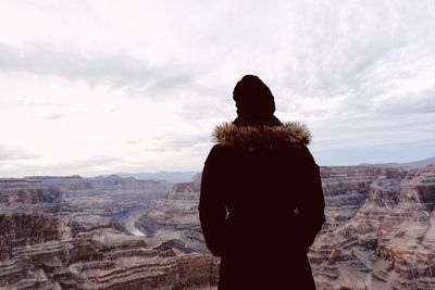 Scenic view of landscape against cloudy sky