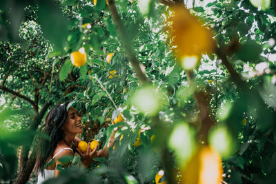 View of woman and yellow tree