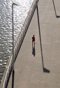 High angle view of man walking at promenade