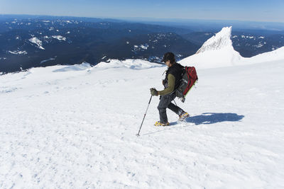 A man climbs down from the summit of mt. hood in oregon.