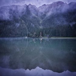 Scenic view of lake and mountains against sky