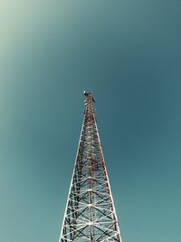 Low angle view of telecommunications tower against clear sky