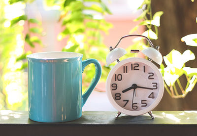 Close-up of clock on table