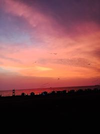 Scenic view of sea against sky at sunset