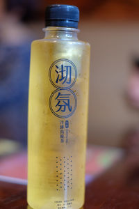 Close-up of text on glass bottle