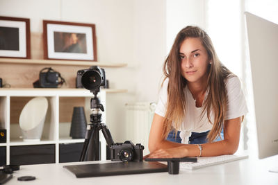 Portrait of woman photographing