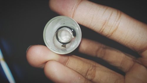 Close-up of hand holding ring