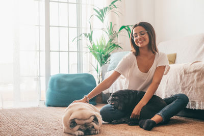 Happy woman with dogs at home