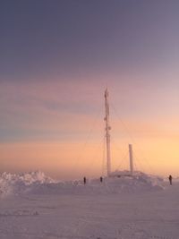 Scenic view of snow against sky during sunset