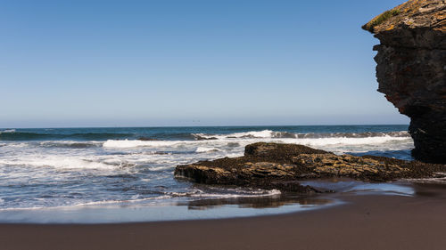 Scenic view of sea against clear sky