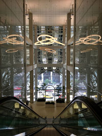 Cars on illuminated bridge in city