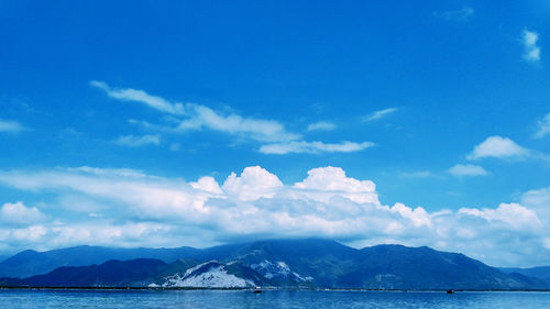 Scenic view of sea against blue sky