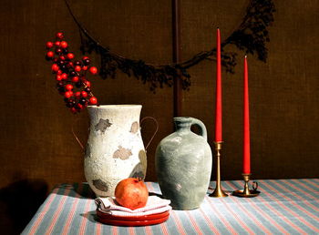 Various fruits in vase on table
