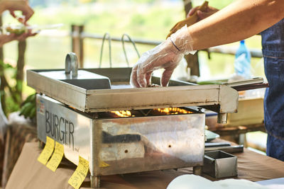 Low section of man working at workshop