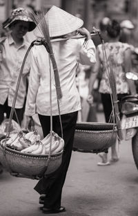 People walking on road in city