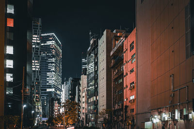 Illuminated buildings in city at night