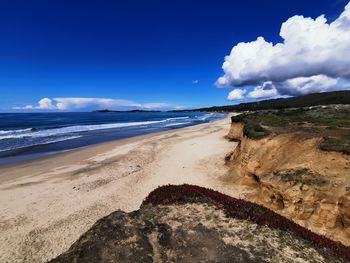 Scenic view of beach against sky