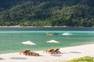 Scenic view of beach on sunny day