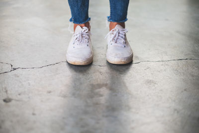 Low section of woman standing on floor