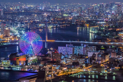 Aerial view of illuminated cityscape at night