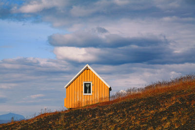 House on field against sky