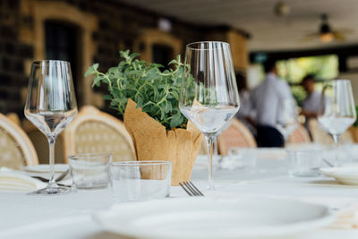 Close-up of wineglasses on table