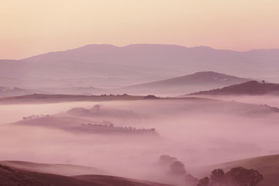 Scenic view of mountains against sky during sunset