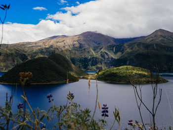 Scenic view of lake and mountains against sky