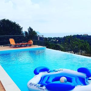 View of swimming pool against blue sky