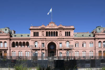 Low angle view of building against clear blue sky