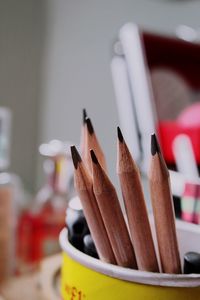 Close-up of wooden pencils in desk organizer