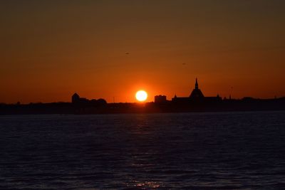 Scenic view of sea at sunset