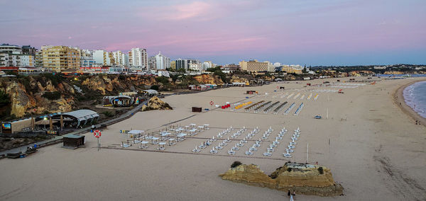 High angle view of buildings by sea against sky