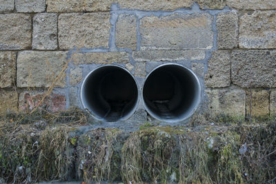 Sewage pipes on wall