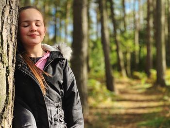 Portrait of teenage girl in forest