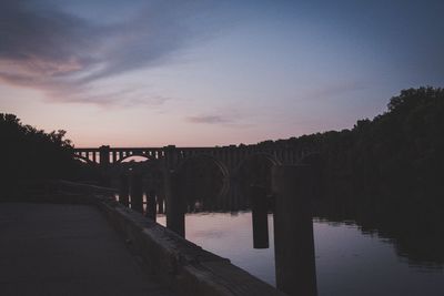 View of bridge over calm sea against the sky