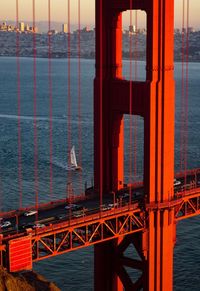 Close-up of suspension bridge in sea