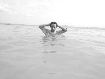 Portrait of young woman in sea