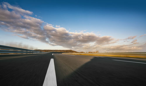 Diminishing perspective of road against sky