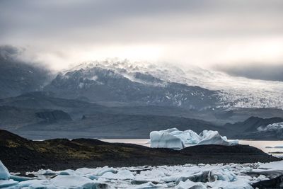 Scenic view of snowcapped mountains against sky