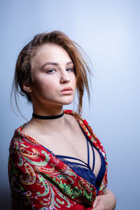 Portrait of a beautiful young woman over white background