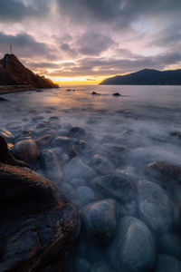 Scenic view of sea against sky during sunset