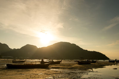 Scenic view of silhouette mountains against sky during sunset