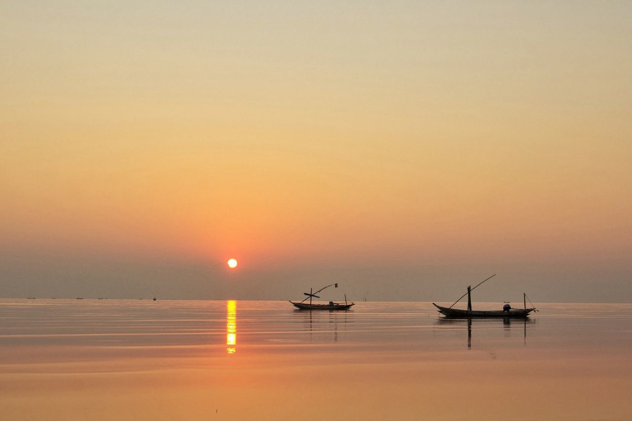 sunset, water, sea, nautical vessel, transportation, boat, horizon over water, mode of transport, orange color, scenics, silhouette, sun, waterfront, beauty in nature, tranquil scene, tranquility, reflection, sky, idyllic, nature
